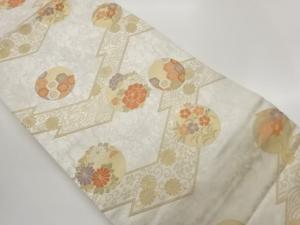 変わり横段に草花・亀甲・波模様織出し名古屋帯